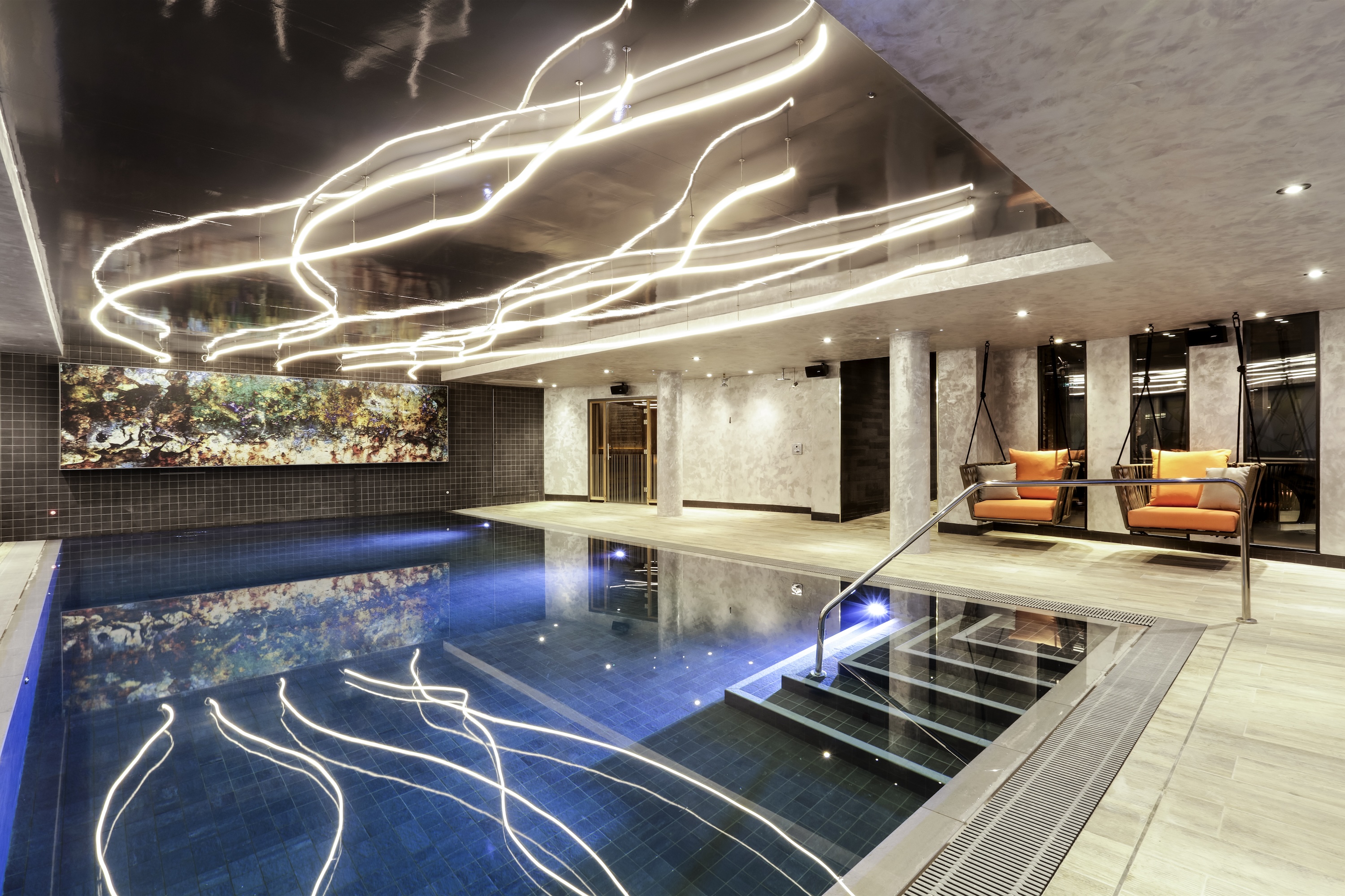 Novotel London hotel pool featuring bespoke LED lighting design with architectural neon lines