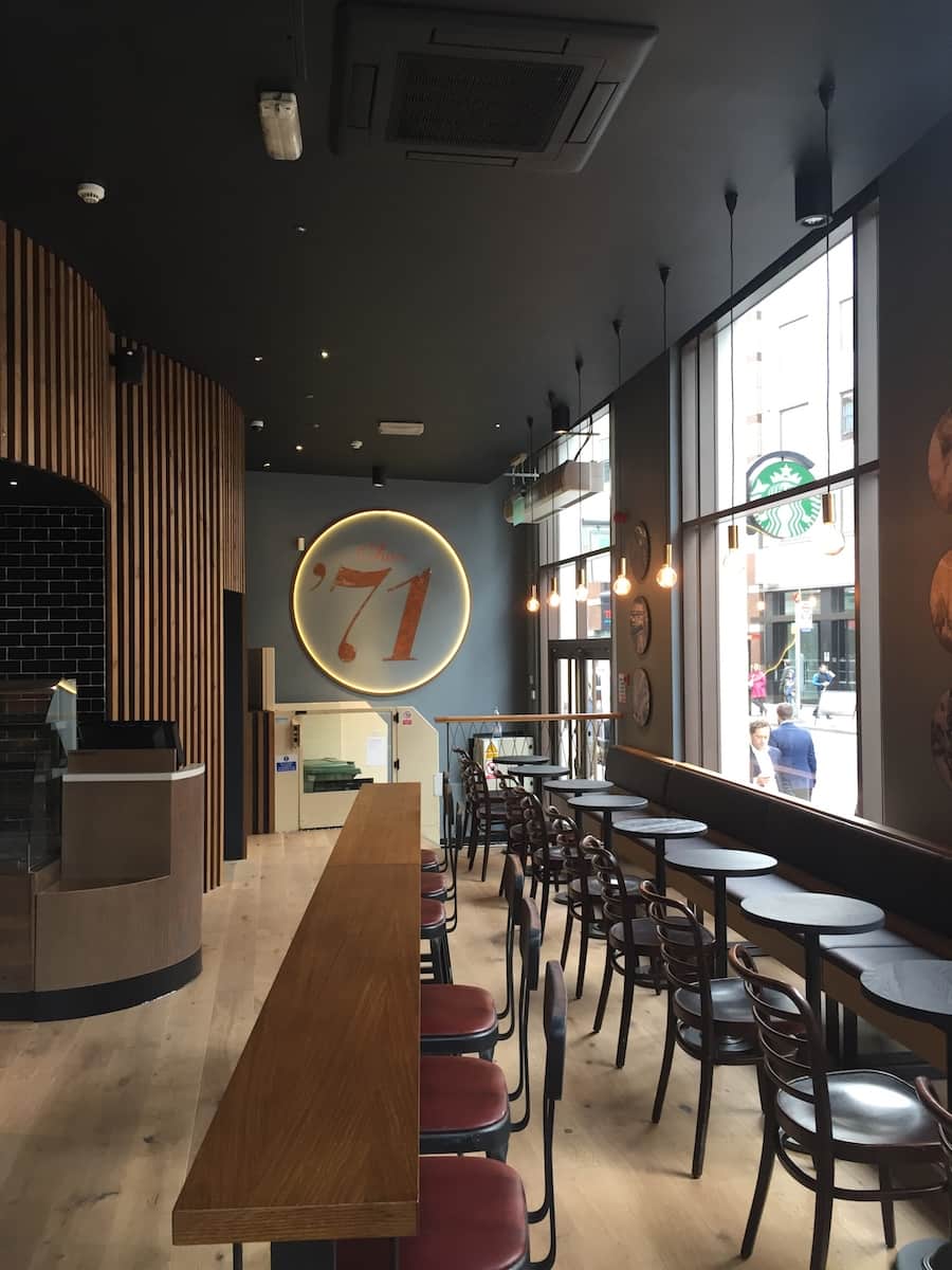 Starbucks London interior featuring ambient LED lighting design enhancing café atmosphere